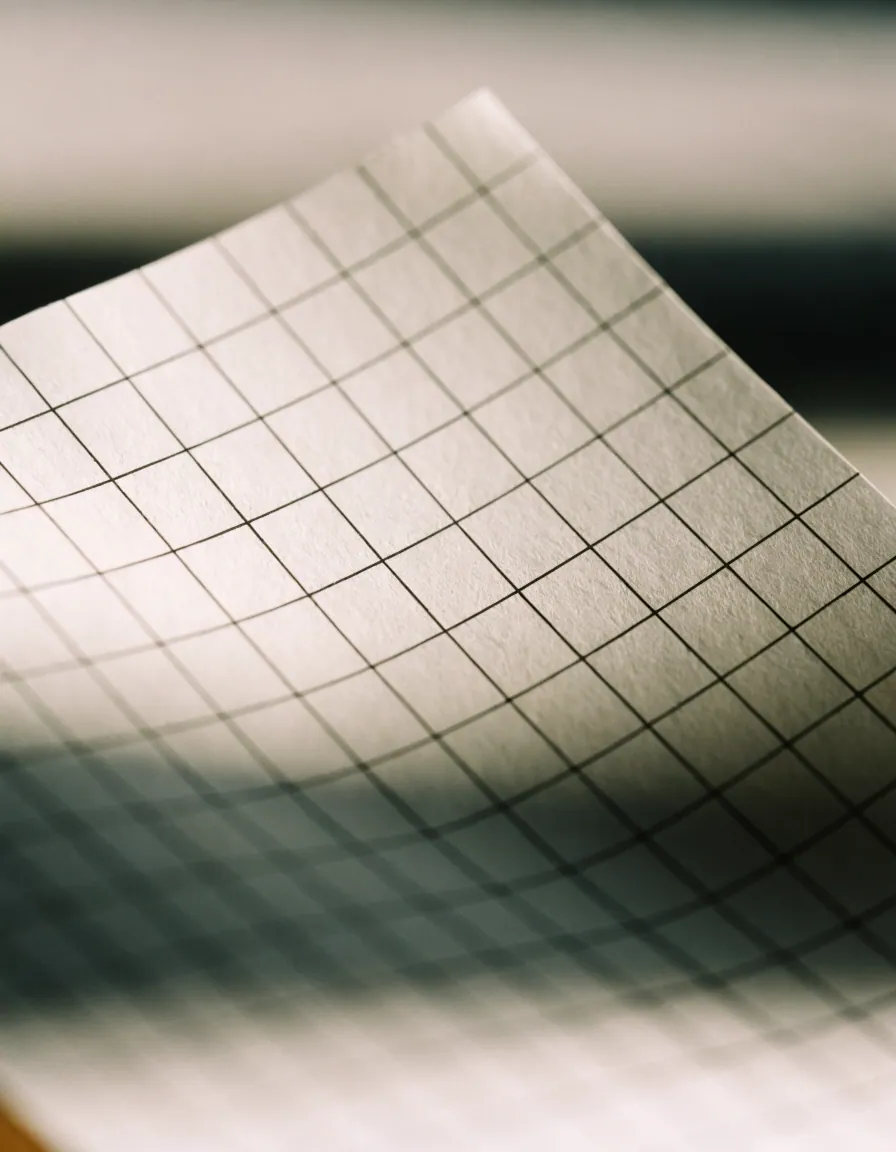 Close-up of a printed grid in warm daylight.