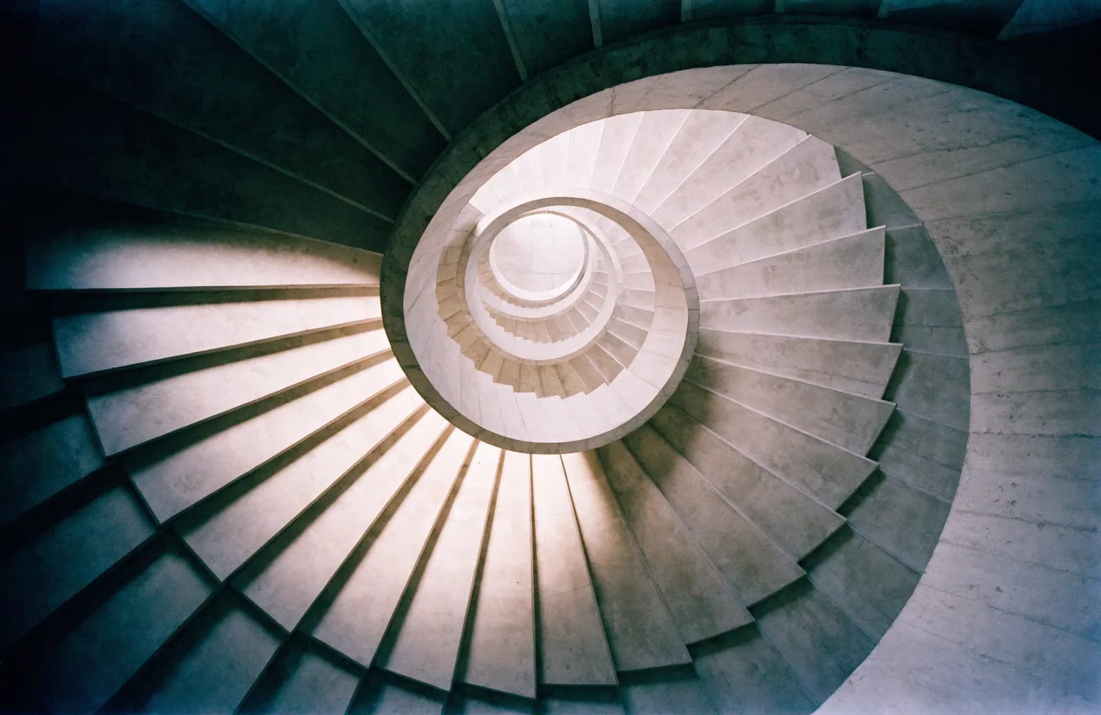 Concrete stair seen from below.